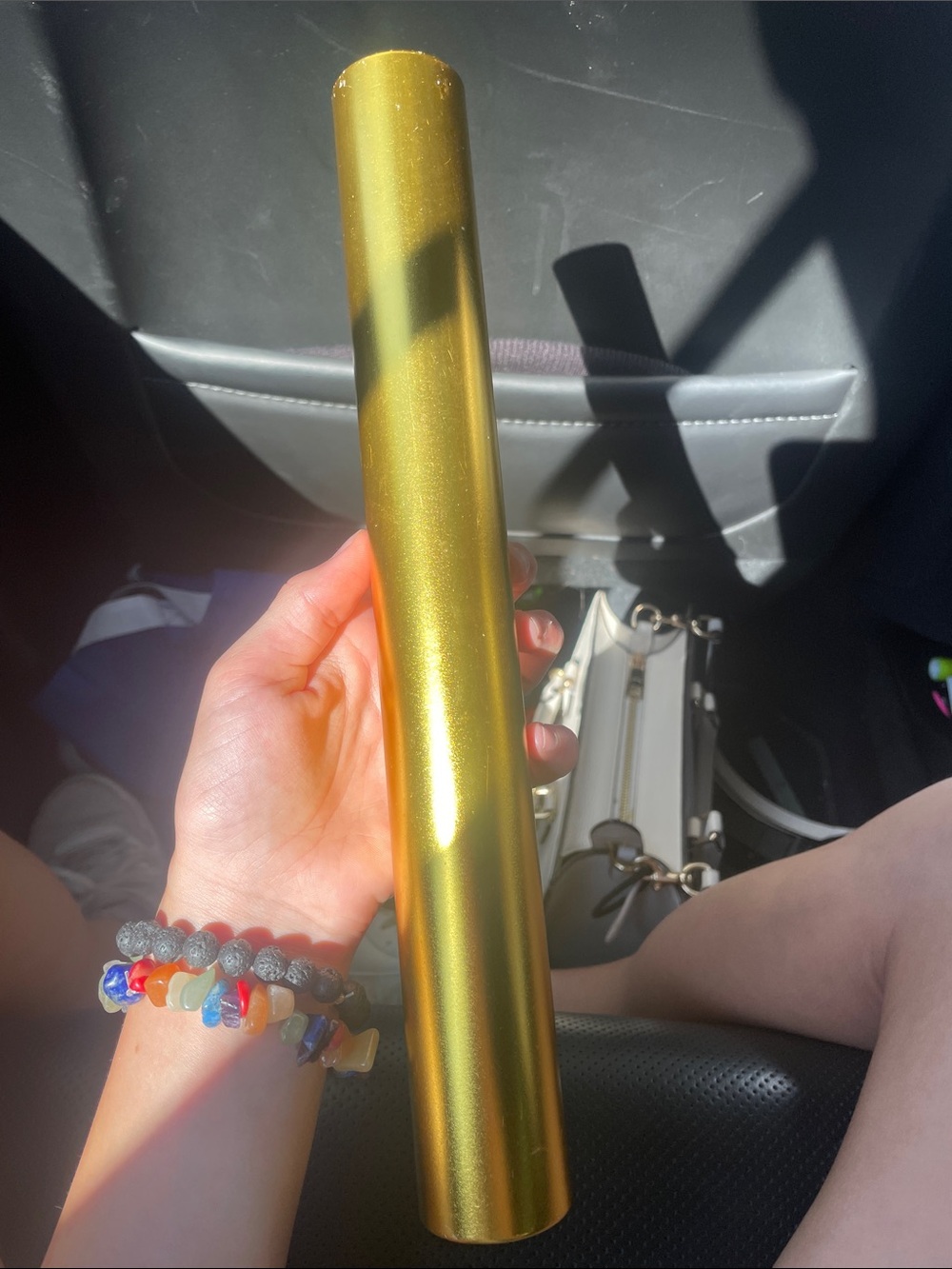 Gold colored baton